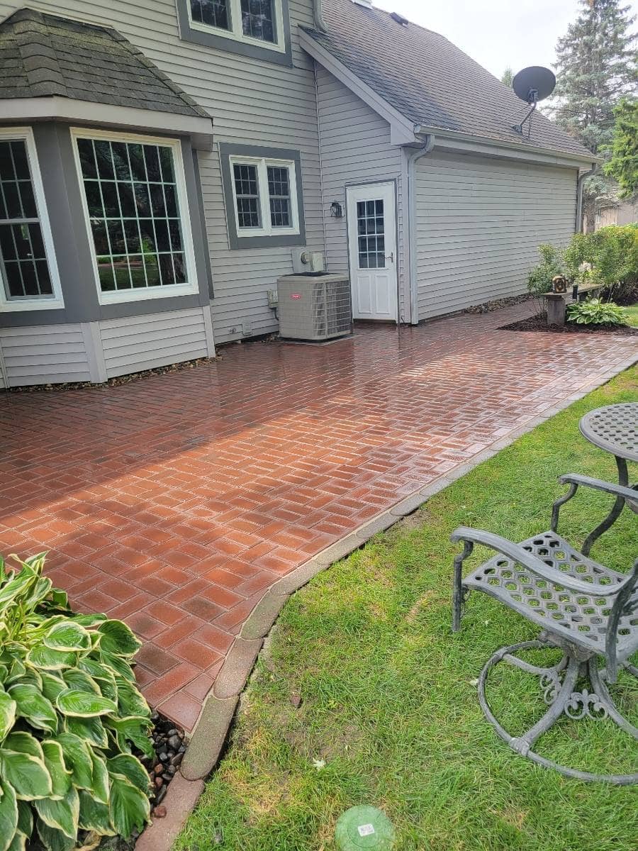 a patio with colored pavers