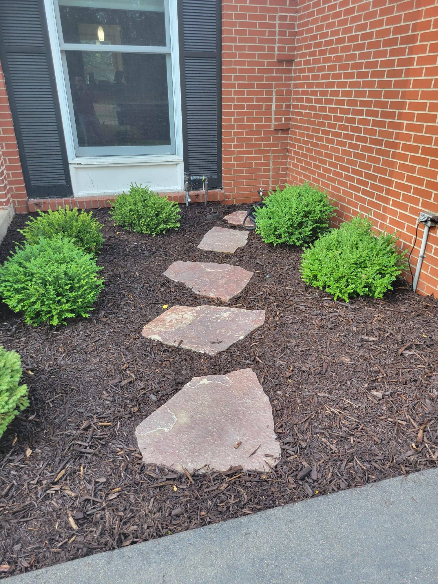 landscaping with mulch and shrubs
